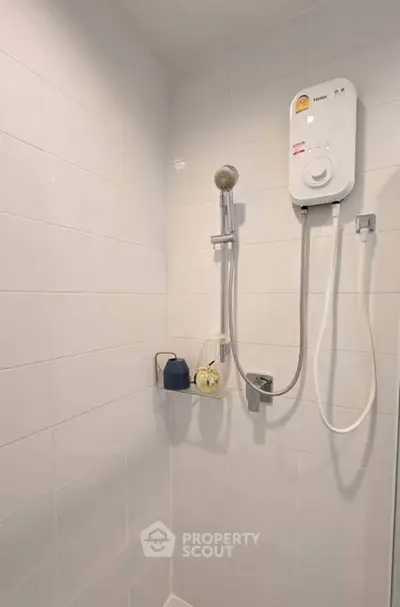 Modern bathroom shower with water heater and tiled walls