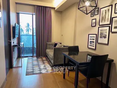 Modern living room with stylish decor and balcony view