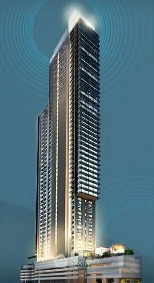 Stunning modern skyscraper with sleek design and illuminated facade, perfect for luxury urban living.