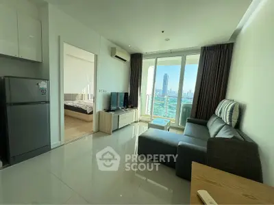 Modern living room with city view, sleek furniture, and large windows in a high-rise apartment.