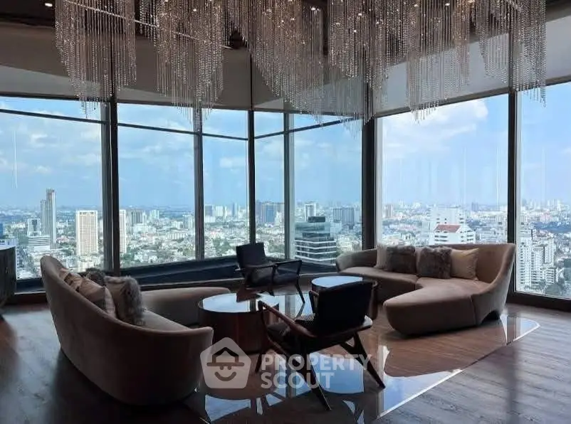 Luxurious living room with panoramic city views and elegant chandelier