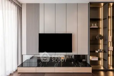 Modern living room with sleek TV unit and elegant shelving