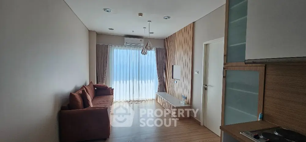 Modern living room with wooden flooring and stylish decor