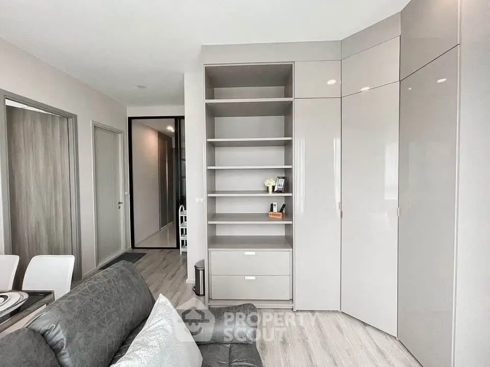 Modern living room with sleek built-in shelving and stylish decor