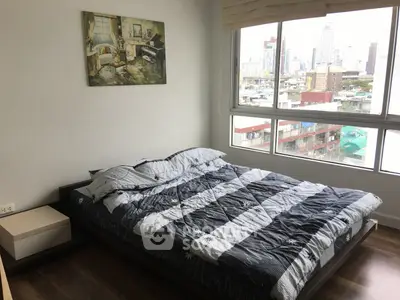 Modern bedroom with city view and stylish decor in urban apartment