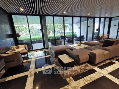 Luxurious modern living room with elegant marble flooring and garden view, perfect for relaxation and entertaining.