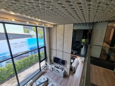 Modern duplex apartment with stylish interior and large windows in Bangkok