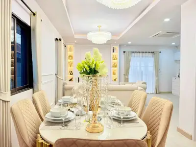 Luxurious dining room with elegant decor and modern lighting in a stylish home