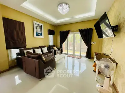 Elegant living room with modern decor, plush seating, and natural light through large windows.