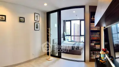 Modern bedroom with large windows and stylish decor in a high-rise apartment.