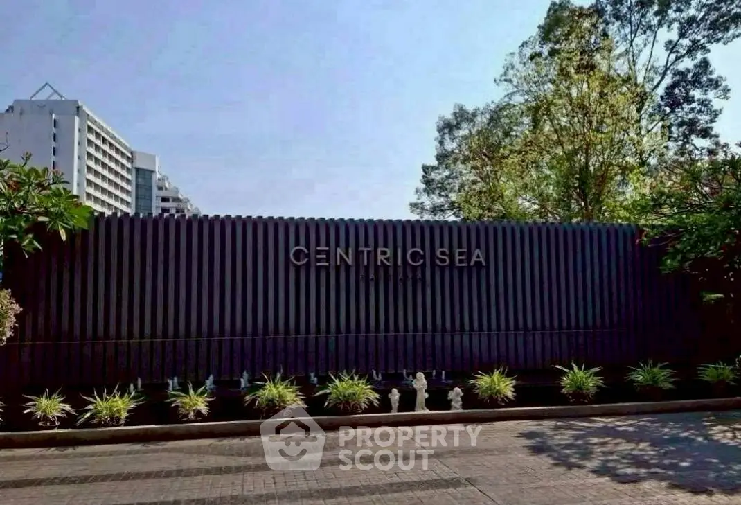 Modern building exterior with lush greenery and sleek design