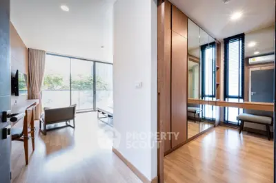 Modern apartment interior with spacious living room and stylish wooden flooring