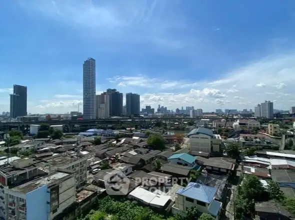 Stunning cityscape view with skyscrapers and residential buildings under a clear blue sky.