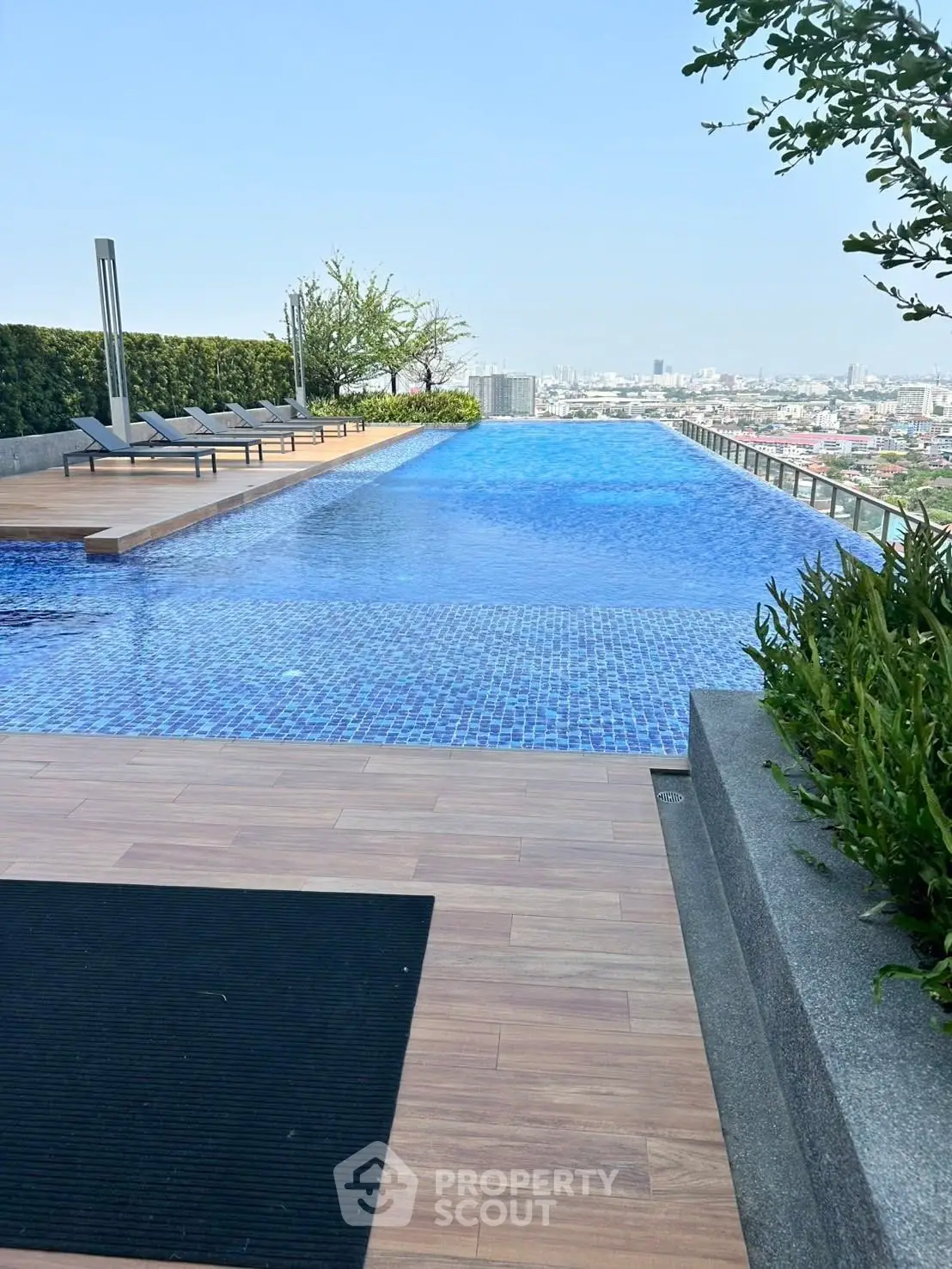 Luxurious rooftop infinity pool with stunning city views and modern design.