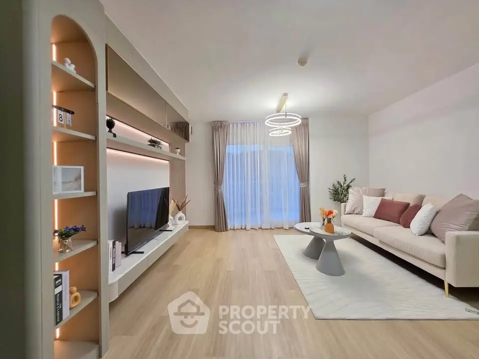 Modern living room with stylish decor and large TV unit