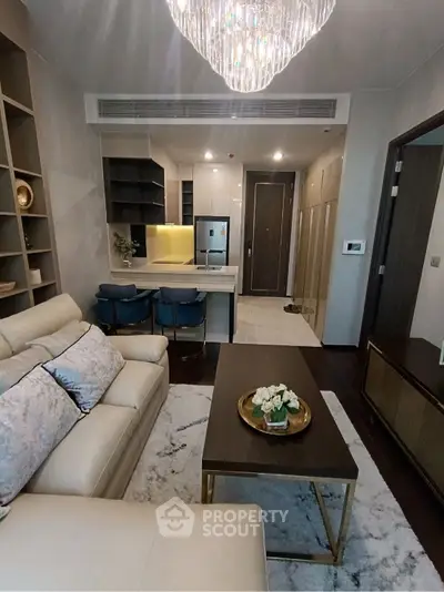 Luxurious modern living room with elegant chandelier and stylish decor