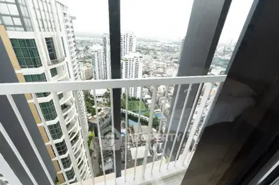 Stunning high-rise balcony view overlooking cityscape with modern architecture.