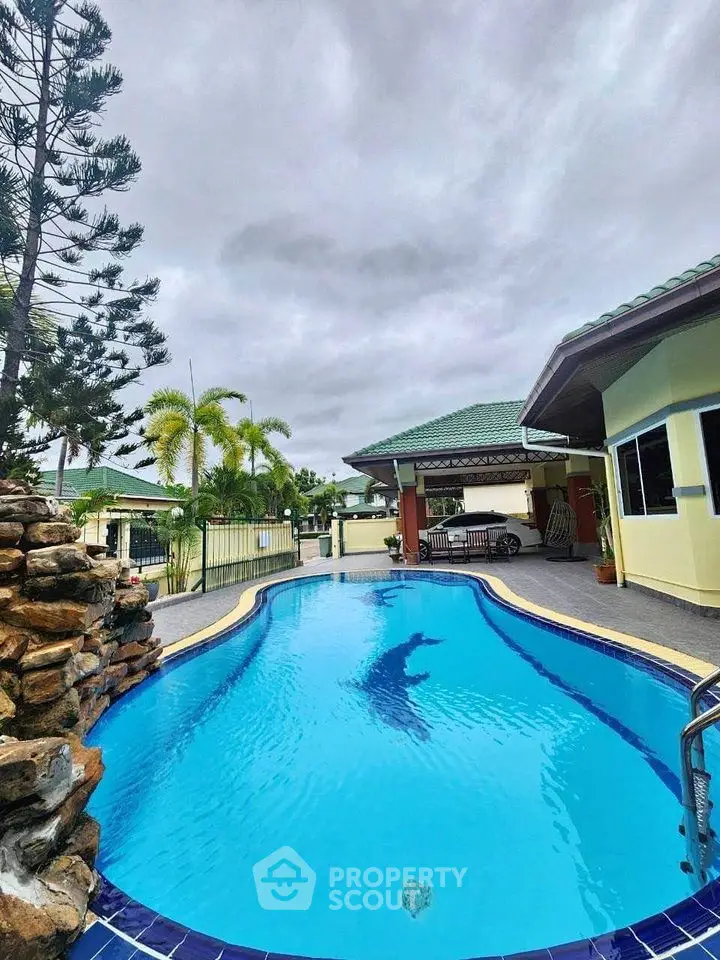 Stunning residential property with inviting swimming pool and lush greenery