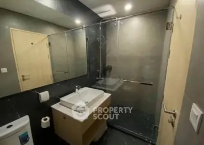 Modern bathroom with sleek design and glass shower enclosure