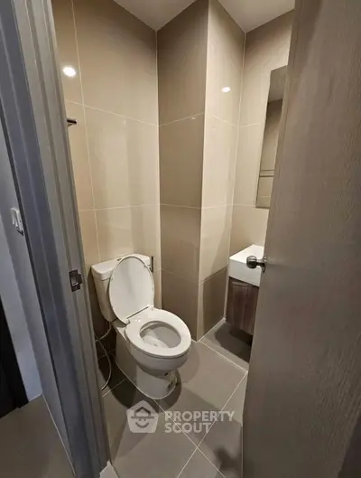 Modern compact bathroom with sleek design and neutral tones