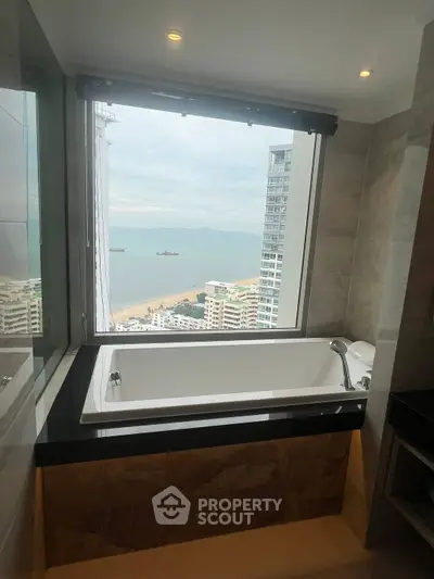 Luxurious bathroom with stunning ocean view from large window