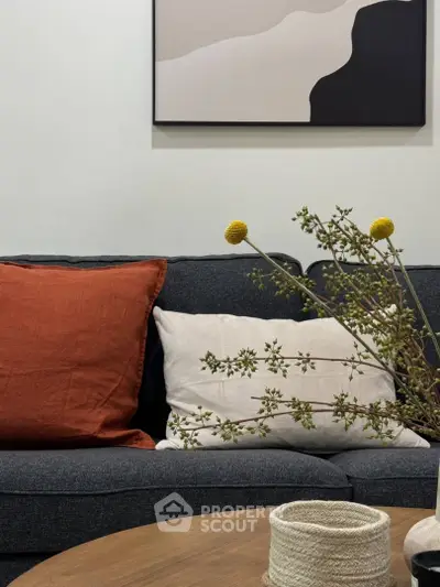Stylish living room with modern decor and cozy sofa, perfect for relaxation.