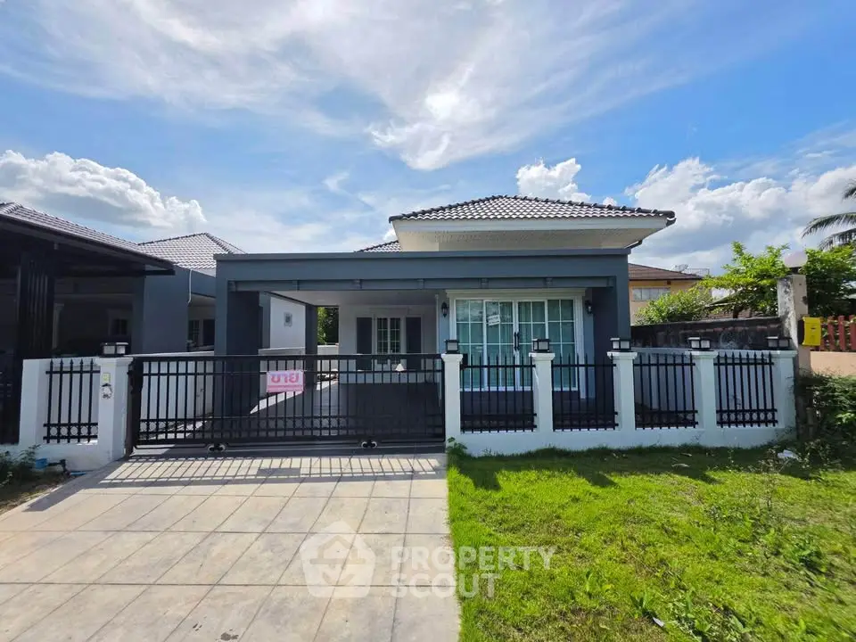 Charming single-story house with modern design and spacious front yard in a serene neighborhood.