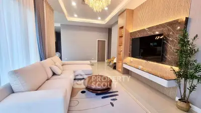 Luxurious living room with elegant decor and modern entertainment center