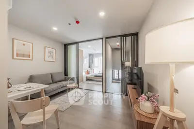 Modern open-plan living room with cozy seating and stylish decor