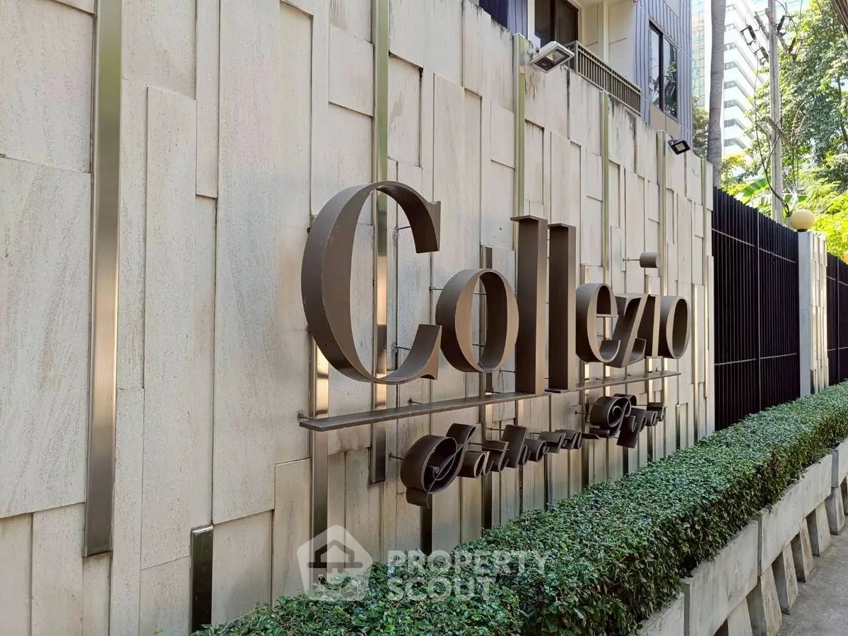 Elegant exterior signage of luxury residential building with modern architectural design.