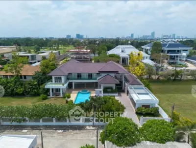 Luxurious suburban villa with private pool and lush garden, offering stunning city views.