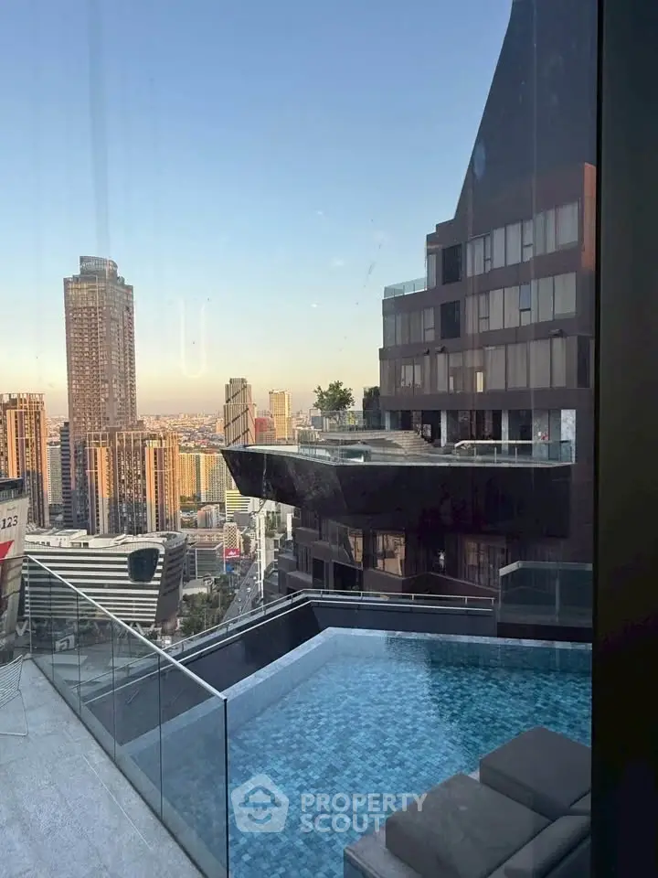 Stunning urban view with luxurious rooftop pool and modern architecture.