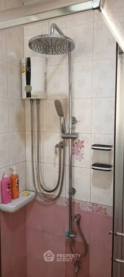 Compact bathroom with modern shower and water heater