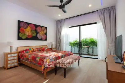 Spacious bedroom with vibrant decor and balcony access in modern apartment.