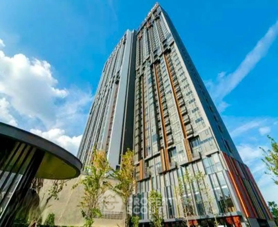 Stunning high-rise building with modern architecture against a clear blue sky.