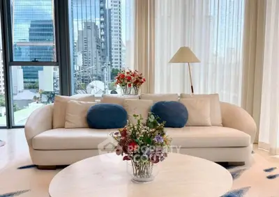 Luxurious living room with modern sofa and city view, perfect for urban living.