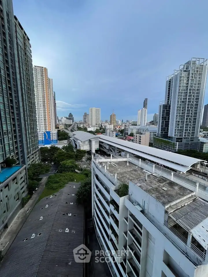 Stunning cityscape view from high-rise building showcasing urban skyline and modern architecture.