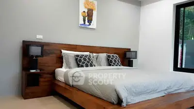 Modern bedroom with stylish wooden bed frame and cozy decor