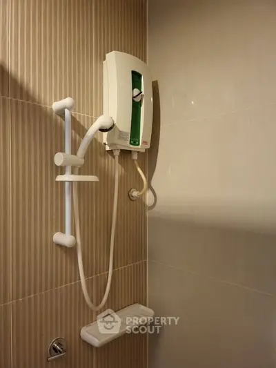 Modern bathroom shower with sleek water heater and elegant tile design