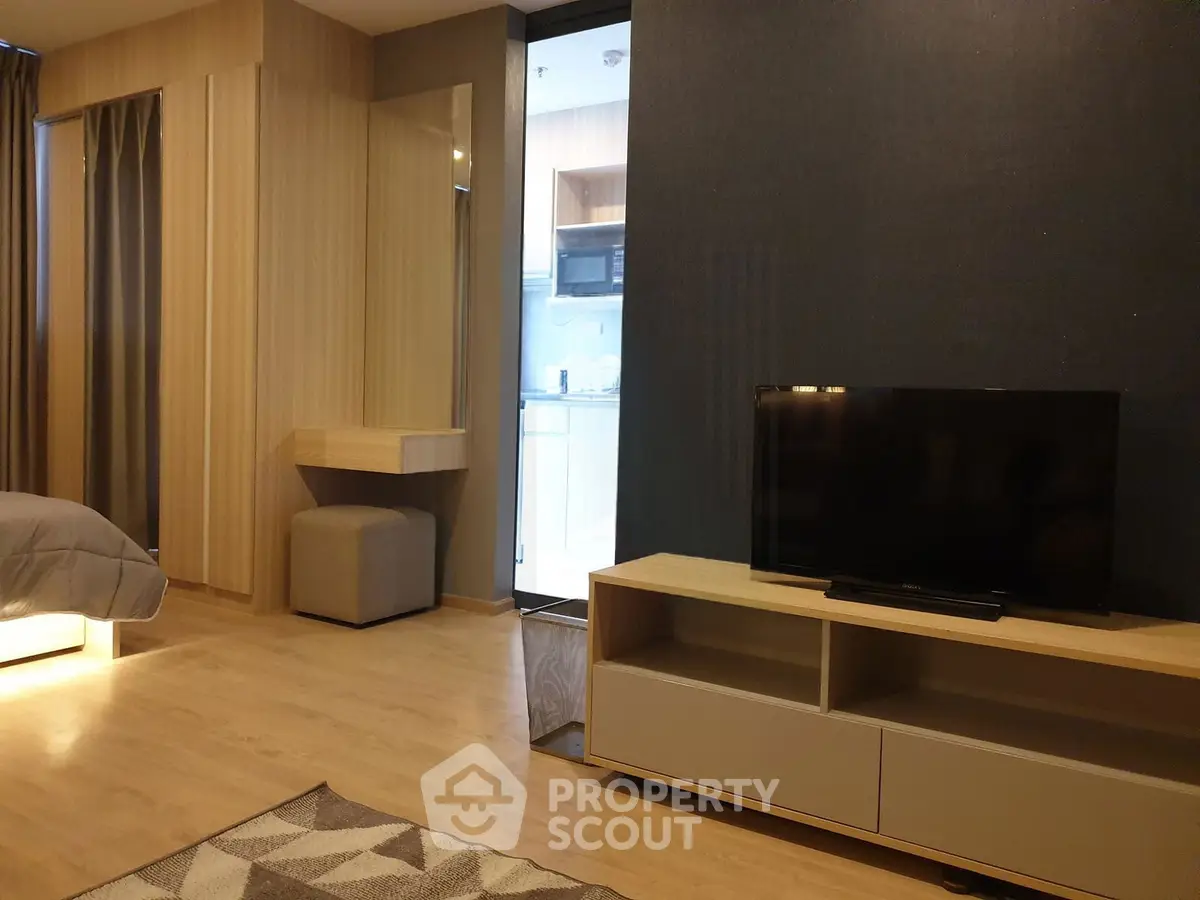 Modern living room with TV and stylish decor in a cozy apartment