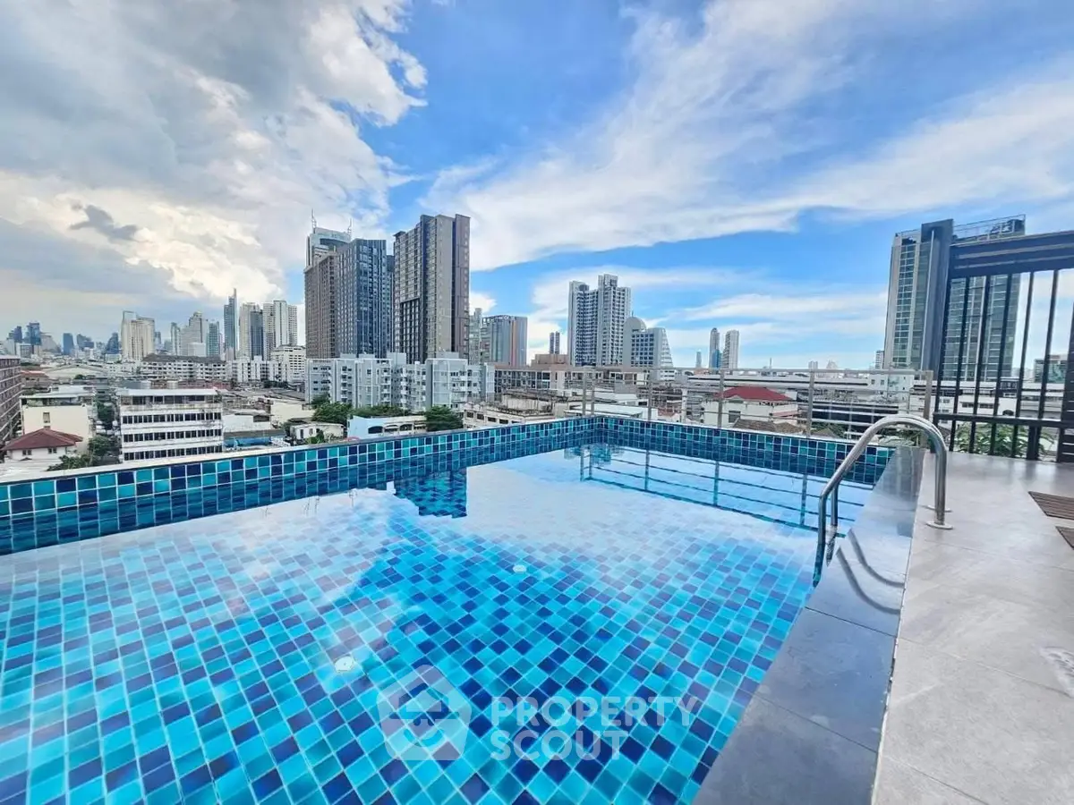 Stunning rooftop pool with panoramic city skyline views