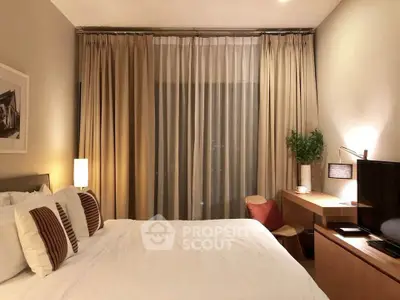 Elegant bedroom with cozy lighting and modern decor, featuring a comfortable bed and stylish workspace.