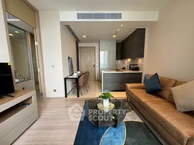 Modern living room with open kitchen and stylish decor