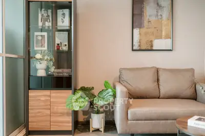 Stylish living room with modern sofa and elegant display cabinet