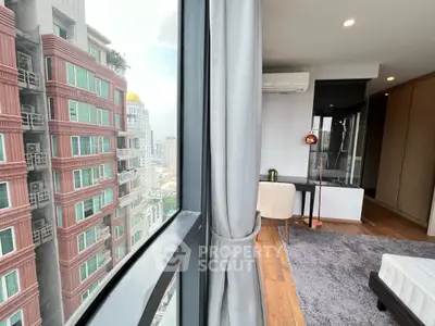 Modern apartment with city view, featuring stylish interior and large windows for natural light.
