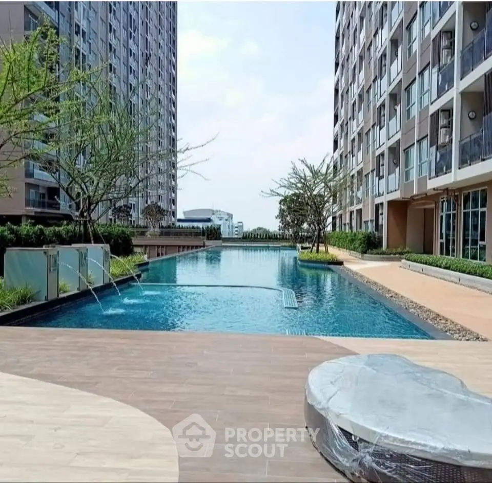 Luxurious apartment complex with stunning pool and modern architecture