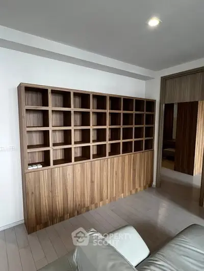 Modern living room with stylish wooden shelving and sleek design