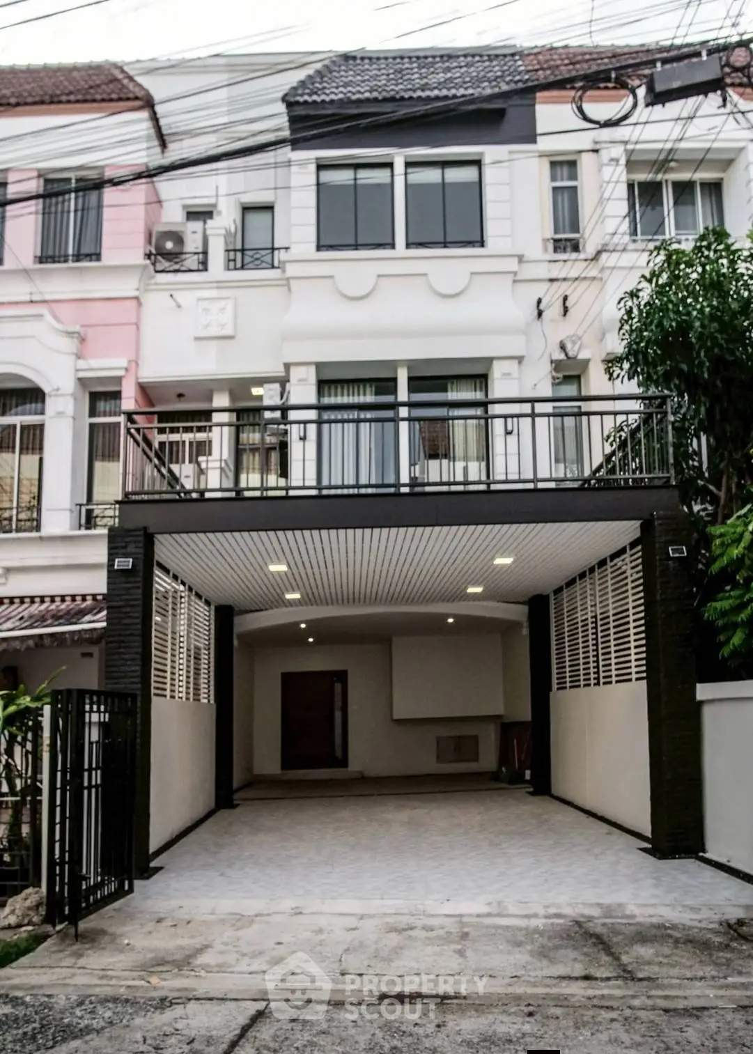 Charming townhouse with spacious garage and modern facade in a desirable neighborhood.