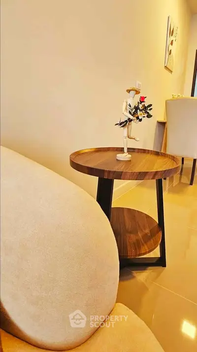 Stylish modern living room with elegant furniture and warm lighting, perfect for cozy relaxation.
