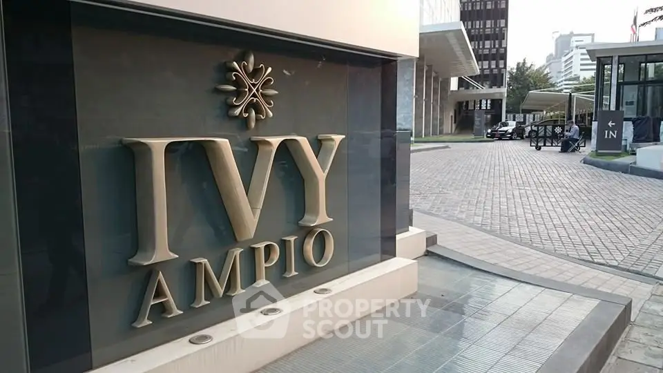 Elegant entrance of Ivy Ampio building with modern architecture and stylish signage.